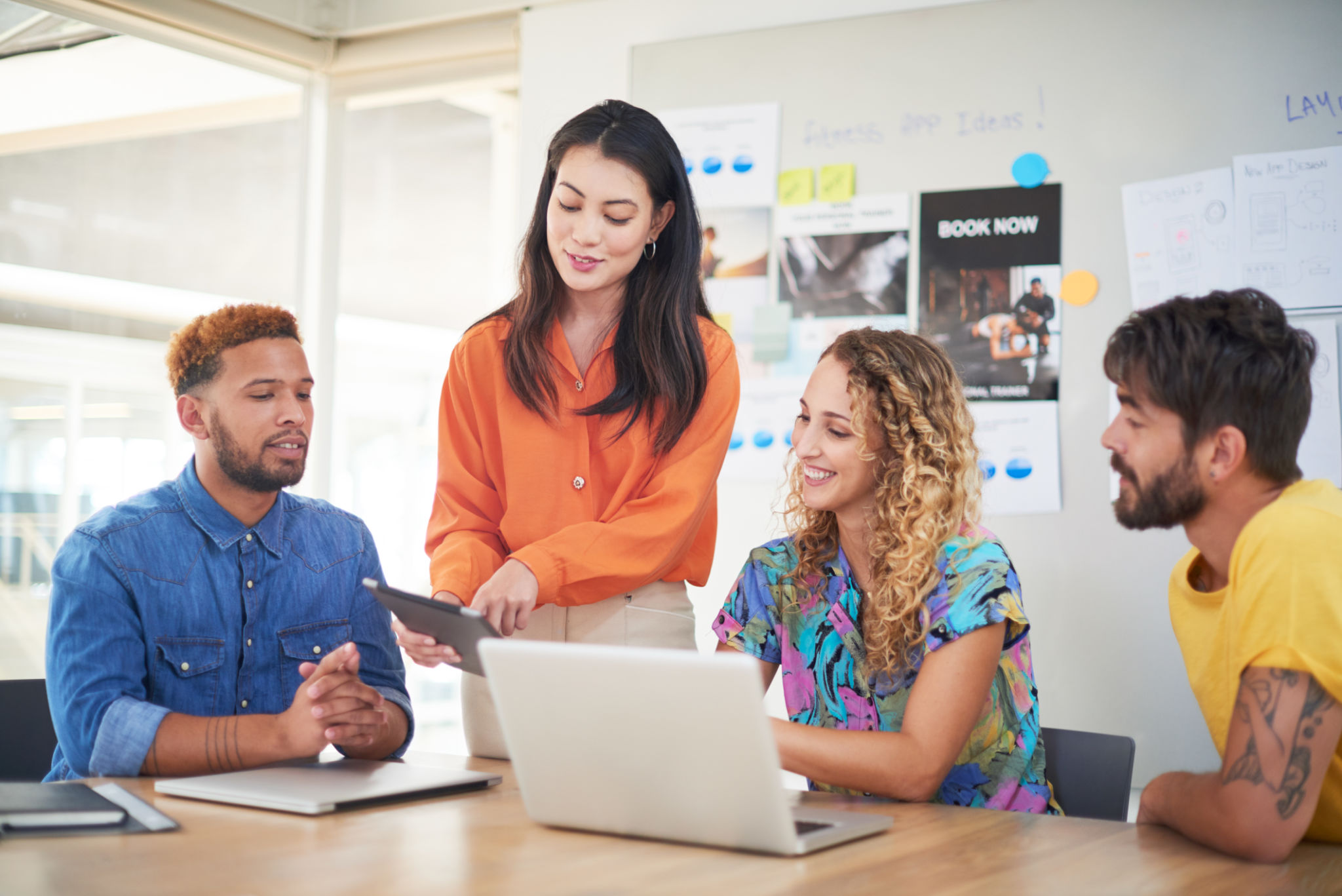 gettyimages-1290528901-2048x2048 Shot of a group of young businesspeople using a laptop and digital tablet in a modern office